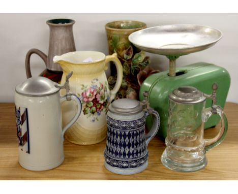 Three German steins, three ceramic items and a vintage kitchen scale.