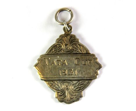 A white metal (tested silver) Tata Cup Winners medal turned into a pendant, c. 1931, L. 4.5cm.