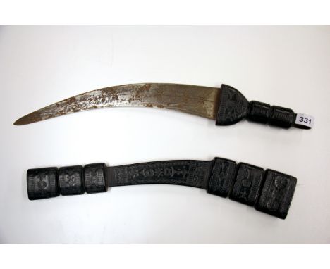 An eastern sword with decorated steel blade and embossed leather hilt and scabbard, L. 67cm.