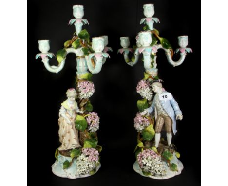 A pair of 19th century German Sitzendorf porcelain figural candelabra, H. 52cm.