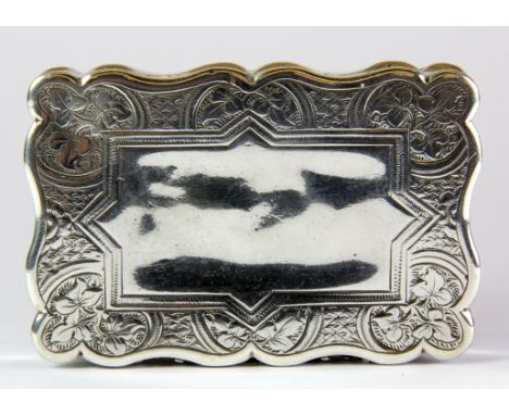 A chased hallmarked (Birmingham c.1869) silver table snuff box by George Unite, 9 x 6 x 1.8cm.