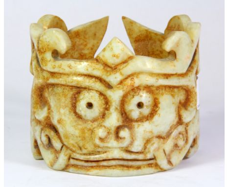 A Chinese carved jade archaic form crown, H. 9.5cm, Dia. 11.5cm.