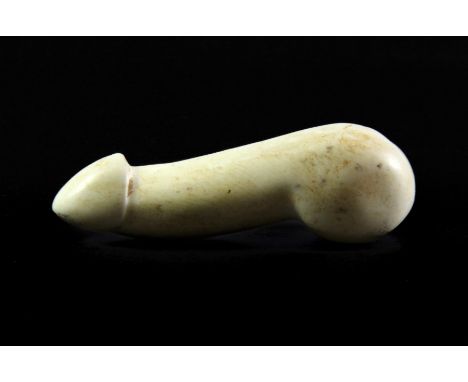 A Japanese erotic carved hardstone netsuke, L. 6cm.