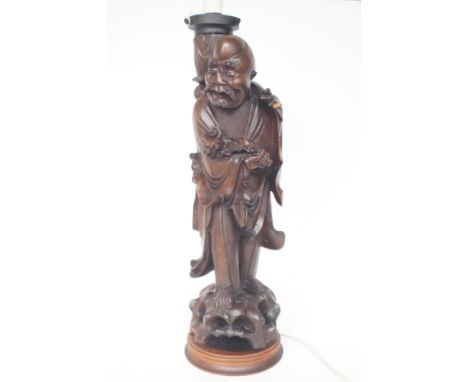 Carved oriental figure/lamp Height 64 cm 