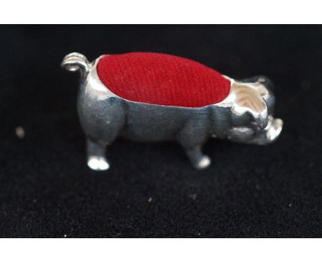 Silver pin cushion in the form of a pig 