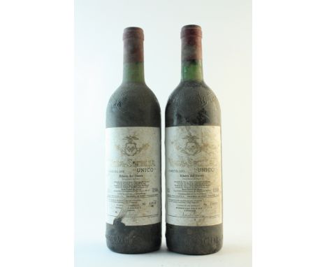 Vega-Sicilia Unico 1975 Ribera del Duero(bin-soiled &amp; damp-stained labels - 1 torn)2 bottlesThis lot is subject to the fo