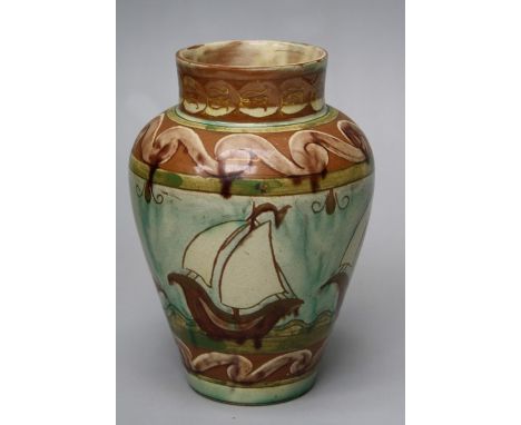 A Della Robbia Art pottery vase of shouldered tapering form, decorated with a broad reserve of sailing boats within scrolling