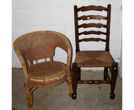 A bamboo and woven cane tub shape conservatory armchair and a single rush seat ladder back side chair