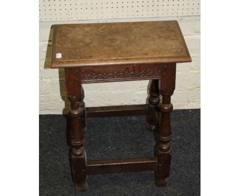 A late 17th century oak joint stool with lunette carved frieze and baluster supports joined by stretchers. 45cm long