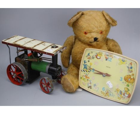 A Smiths Noddy nursery clock, a Mamod Steam Tractor and an early 20th century straw filled fully jointed teddy bear