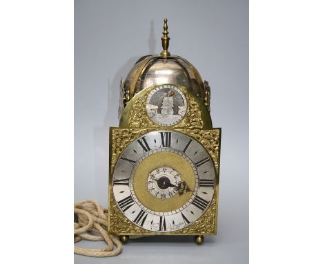 A part 18th century thirty hour alarm, lantern timepiece with verse escapement and later "rocking sun" detail to the broken a