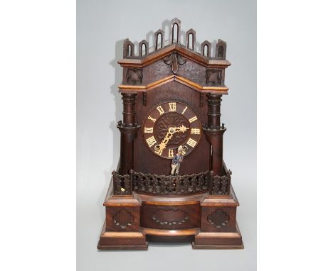 A late 19th century "Black Forest" automaton clock in the form of a soldier patrolling the ramparts of the castle form case. 