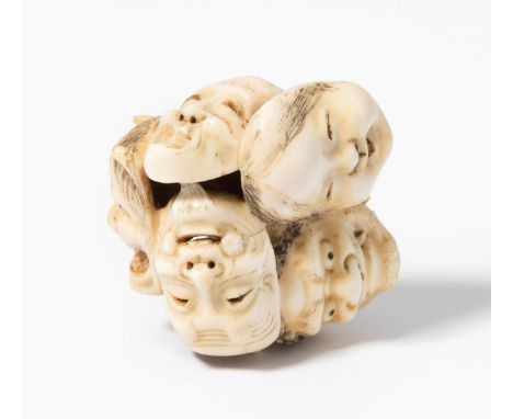 Manjû-NetsukeJapan. Elfenbein. Signiert. Plastische Dastellung von sechs verschiedenen Masken. H 3,5 cm.