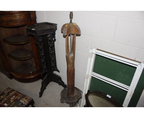 An unusual floor standing hardwood lamp, signature to base