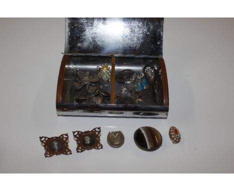 An engine turned decorated box and contents of various miscellaneous items to include a silver mourning brooch in the form of