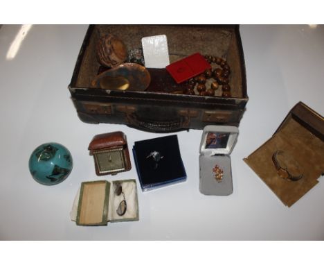 A suitcase and contents of various items to include compact, beaded costume jewellery, a Shakespeare glass paperweight, a box
