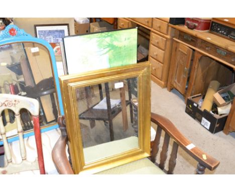 A gilt framed wall mirror and a print 