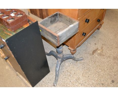 A tripod base with attached planter