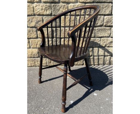 A 19th Century comb back Windsor type armchair.