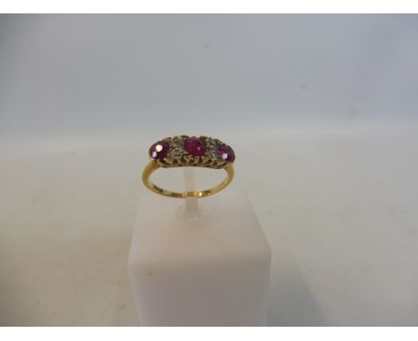 A cased 18ct gold ruby and diamond ring, size n, 2.8g.