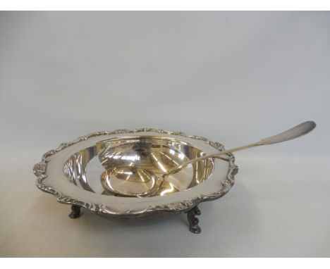 A good quality silver plated serving dishes raised upon three hoof supports, plus a white metal ladle, possibly Continental, 