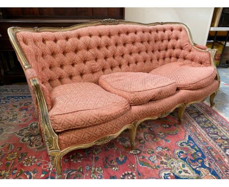 A 19th Century French style button back upholstered settee with pointed show-wood frame and loose seat cushions, approx. 70" 