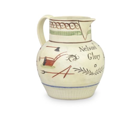 A pearlware jug, circa 1800-10Of globular shape, with engine turning above the base and the neck, the inscription 'Nelsons Gl