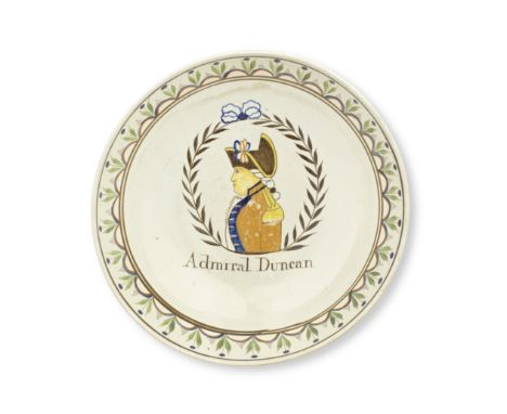 A pearlware footed bowl, circa 1800The interior painted in underglaze Pratt-type colours with a titled portrait of 'Admiral D