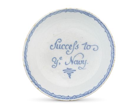 An English delftware bowl, circa 1775-80The interior inscribed in blue 'Success to ye Navy', below a scrolling border, the ex