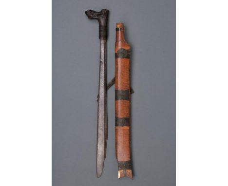 dating: circa 1900 provenance: Borneo, Single-edged blade with the back undulated toward the weak; wooden hilt of typical sha