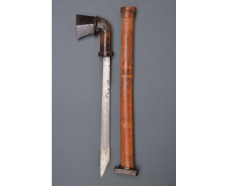 dating: 19th Century provenance: Sulawesi, Strong and wide, single-edged blade with oblique tip, in pamor. Wooden hilt with a