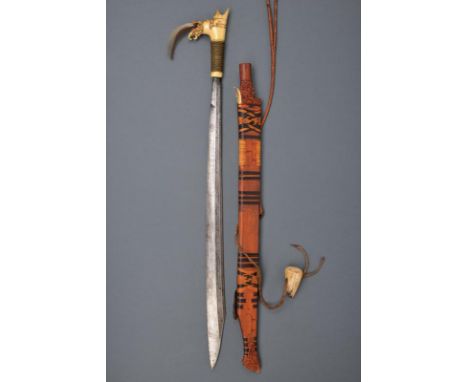 dating: early 20th Century provenance: Kalimantan, Strong and long, single-edged blade; typical, bone hilt, richly embossed, 