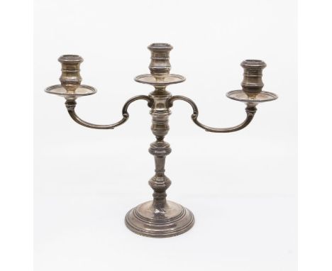 A George I style silver three light candelabra, detachable knopped candlestick, hallmarked by William Comyns, London, the can