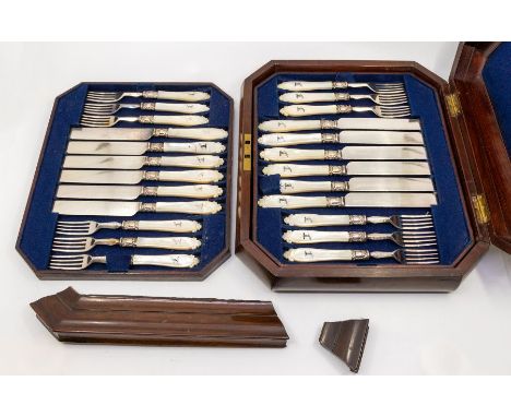 A set of eighteen Victorian silver plate and mother-of-pearl mounted fruit knives and forks, (1 fork missing) 24 handles with