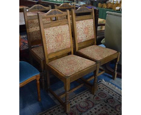 A Set of Four "Old Charm" Oak Framed Dining Chairs with Tapestry Pad Seats and Backs 