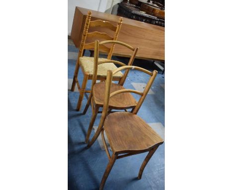 A Pair of Bentwood Side Chairs and a Rush Seated Ladder Back Chair 