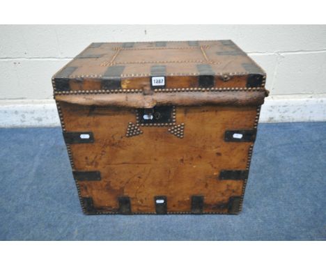 A VICTORIAN TANNED LEATHER TRUNK, with metal banding, twin leather handles and studded details, labelled Joseph Fletcher to i