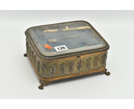 A FRENCH JEWELLERY CASKET, an embossed brass box with glass viewing panel to the hinged lid, removable tray   for vanity item