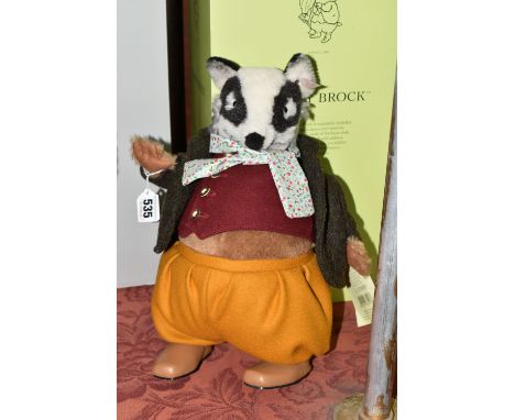 A BOXED STEIFF BEATRIX POTTER LIMITED EDITION 'TOMMY BROCK', the badger character with alpaca and cotton 'fur', wearing a bro