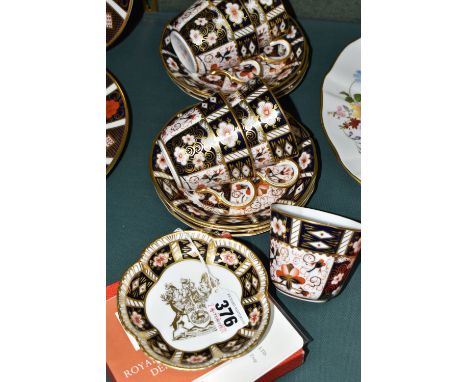 A GROUP OF ROYAL CROWN DERBY IMARI 2451 TEA CUPS, SAUCERS AND A TRINKET DISH, comprising a boxed limited edition City of Derb