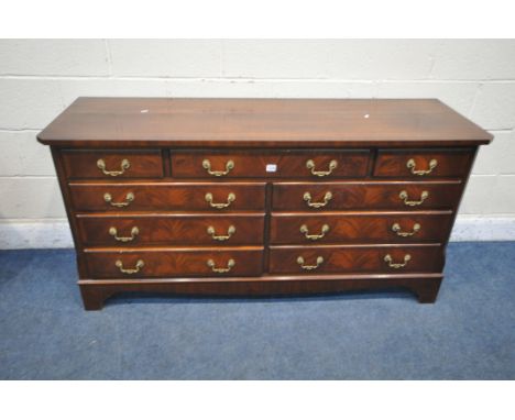 A REPRODUX MAHOGANY SIDEBOARD / CHEST OF DRAWERS, with canted corners, fitted with nine various drawers, on bracket feet, len