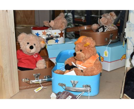 FOUR STEIFF BEARS IN SUITCASES, comprising Fynn (111471), Fynn (111730), 'Master Builder' Fynn (111907) and Sport Fynn (11125