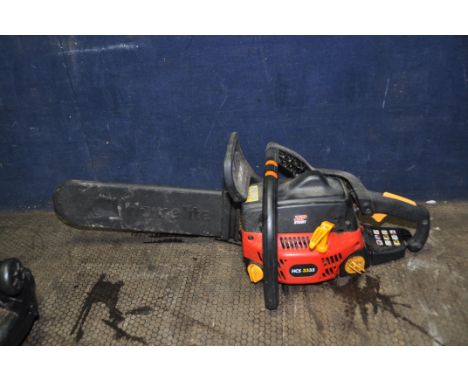 A HOMELITE HCS3335 PETROL CHAINSAW with 14in blade and cover (engine starts and runs)