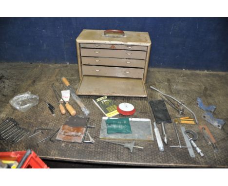 A VINTAGE AND METAL ENGINEERS TOOLCHEST with removable front with lock but no key concealing four graduated drawers and  cont