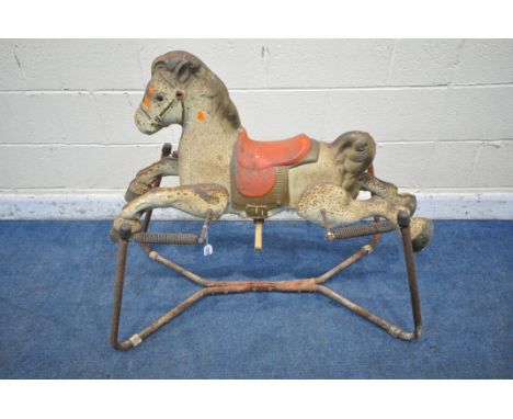 A 20TH CENTURY MOBO PRAIRIE KING ROCKING HORSE, on a sprung stand (condition report: missing handles, highly rusted, other im