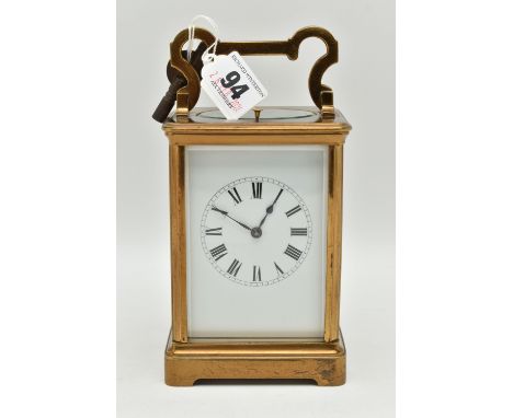 A FRENCH BRASS REPEATER CARRIAGE CLOCK, white Roman numeral dial, blue steel hands, five glass viewing panels, push button to