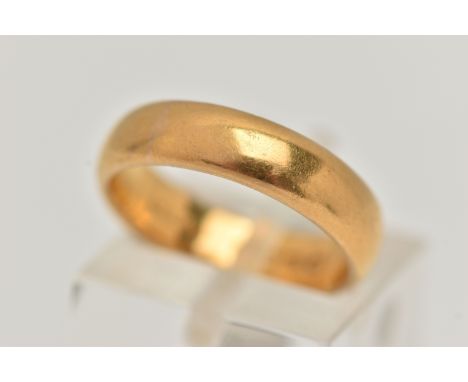 A 22CT YELLOW GOLD BAND RING, polished wide band, approximate band width 4.9mm, hallmarked 22ct London, engraved to the insid