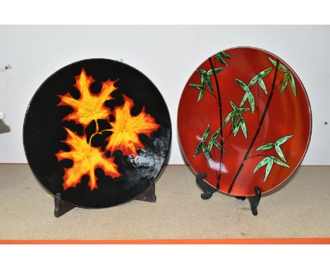 TWO MODERN POOLE POTTERY CHARGERS, comprising an 'Autumn Leaves' charger, diameter 40.5cm and a  red and green 'Bamboo' desig