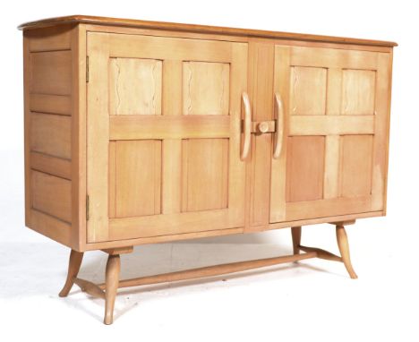 Ercol - A 1970's retro vintage beech and elm blonde wood short sideboard credenza having the plank top and double door cupboa