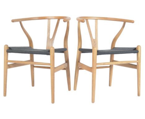 After Hans Wegner - CH24 Wishbone Chair - A pair of retro vintage style chairs / armchairs&nbsp; comprising of a solid ash be